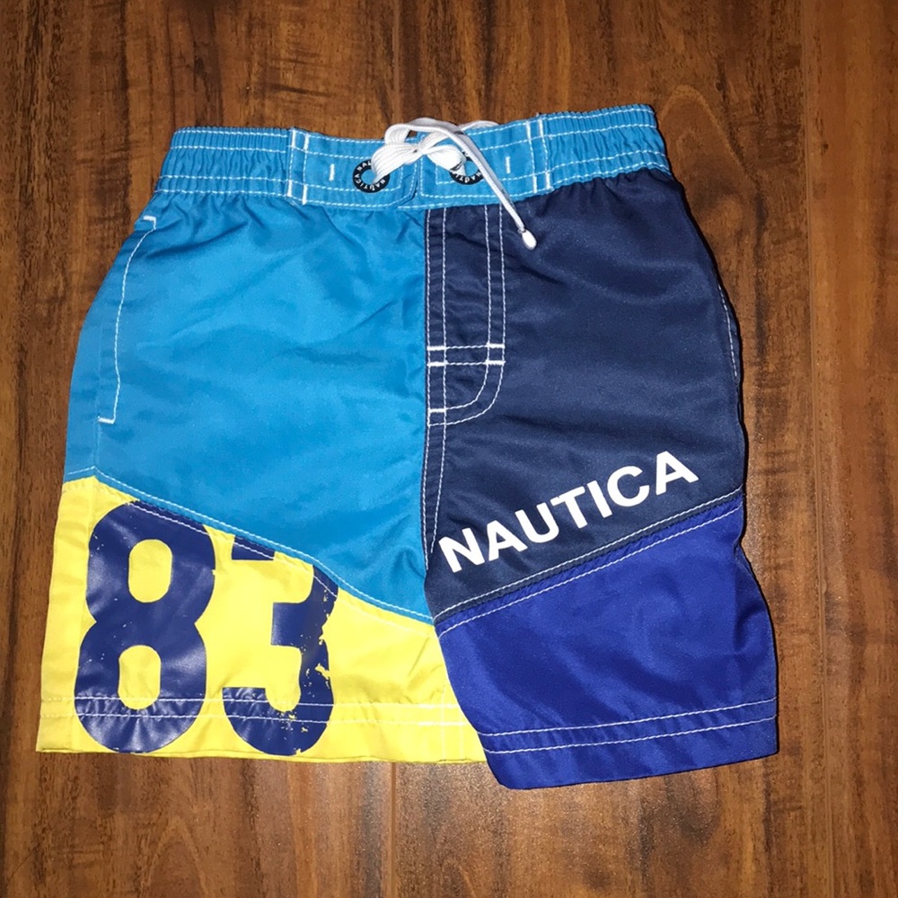 Nautica blue and yellow swim trunks for boys